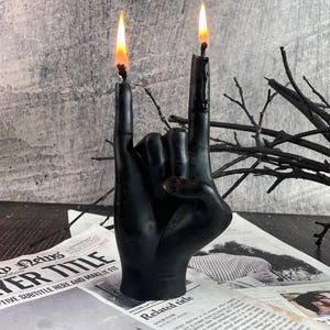 Textured black candle glowing during a meditative session