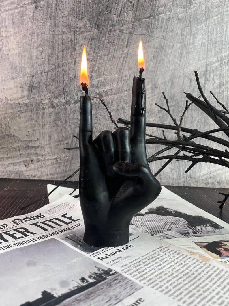 Textured black candle glowing during a meditative session