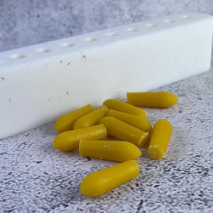 Close-up of uniform suppositories made using the mold