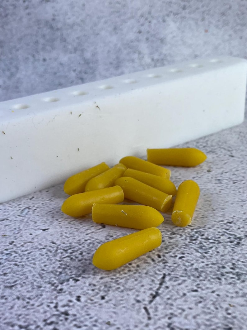 Close-up of uniform suppositories made using the mold