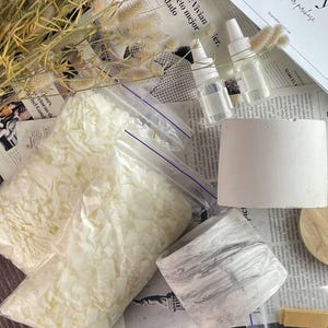 Complete soy wax candle kit with fragrance oils, wicks, jars, and instructions.