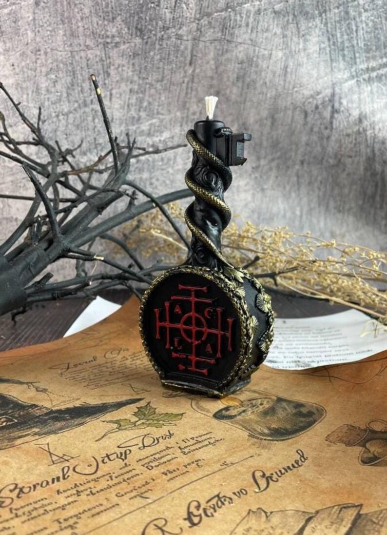 Reverse side of the candle showing intricate red magical sigil engraved in circular base