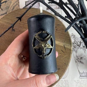 Baphomet candle surrounded by magical symbols for ritual energy work