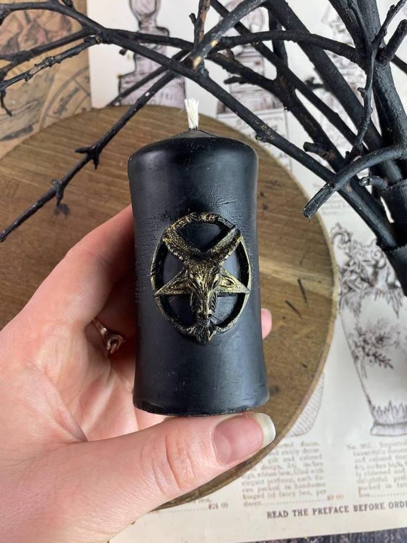 Baphomet candle surrounded by magical symbols for ritual energy work