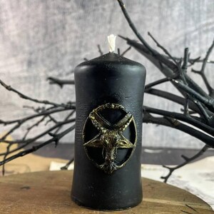Mystical spell candle glowing in a dark, moody atmosphere