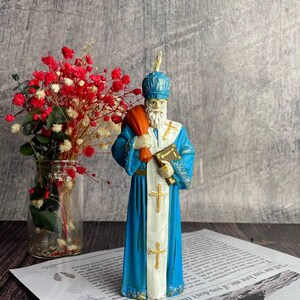 Sacred holiday candle with a warm glow for spiritual and Christmas traditions