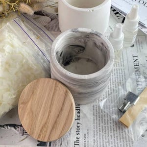 Two marble jars with soy wax candle kit, perfect for home craft projects.