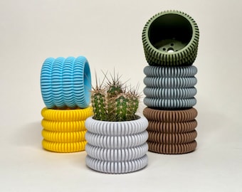 Kleine moderne 3D-geprinte plantenpot met drainagegaten