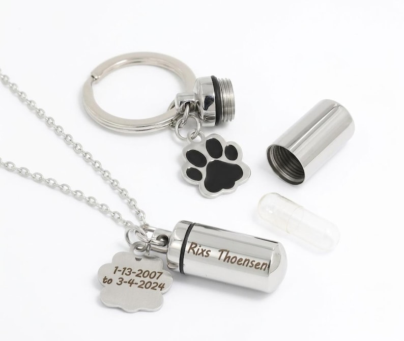Sleutelhanger met urn in de vorm van een pootafdruk, asbewaarhangertje, gepersonaliseerde crematieketting, cilindervormig asmedaillon, ashouder voor huisdieren, rouwgeschenk bij verlies van een huisdier afbeelding 1
