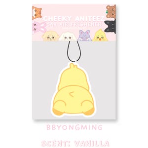 May include: A yellow cartoon chick car air freshener with the text "CHEEKY ANITEEZ CAR AIR FRESHENER" and "BBYONGMING" and "SCENT: VANILLA" on the packaging.