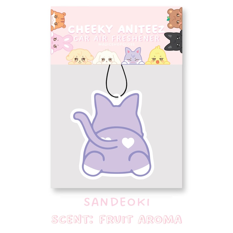 May include: Purple cat-shaped car air freshener with a white heart on its back. The air freshener is hanging from a string and has the text "CHEEKY ANITEEZ CAR AIR FRESHENER" and "SANDEOKI" on the packaging. The scent is "FRUIT AROMA".