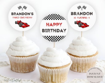 May include: Three cupcake toppers featuring a red race car and checkered flag design. The toppers say "Brandon's Third Birthday", "Happy Birthday", and "Brandon is Turning 3".