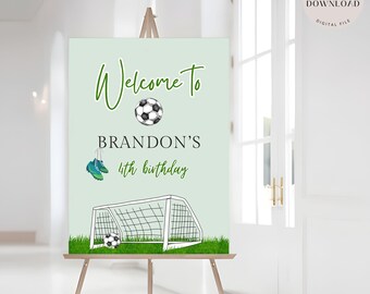 May include: A green and white welcome sign with a soccer ball, soccer cleats, and a soccer goal. The sign says "Welcome to Brandon's 4th birthday".