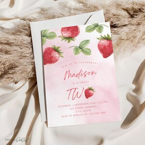 May include: Pink and white watercolor birthday invitation with a strawberry theme. The invitation says "Join us to celebrate Madison is a sweet two."  It also includes the date, time, address, and RSVP information.