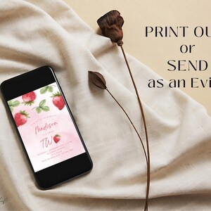 May include: A digital invitation for a birthday party with a pink watercolor background and strawberry illustrations. The text on the invitation reads "You're so sweet! Madison is turning Two!"