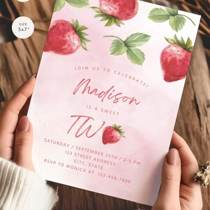 May include: Pink birthday invitation with a watercolor strawberry design. The invitation says "Join us to celebrate! Madison is a sweet two. Saturday, September 25th, 2-5 pm. 123 Street Address, City, State. RSVP to Monica at 123-456-7890."