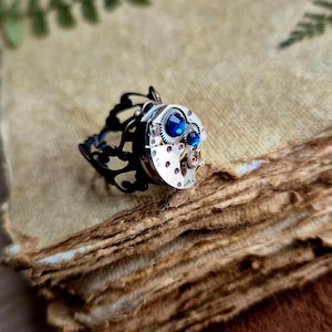 Steampunk Ring with Blue Stone and Watch Parts. Vintage watch mechanism jewelry.