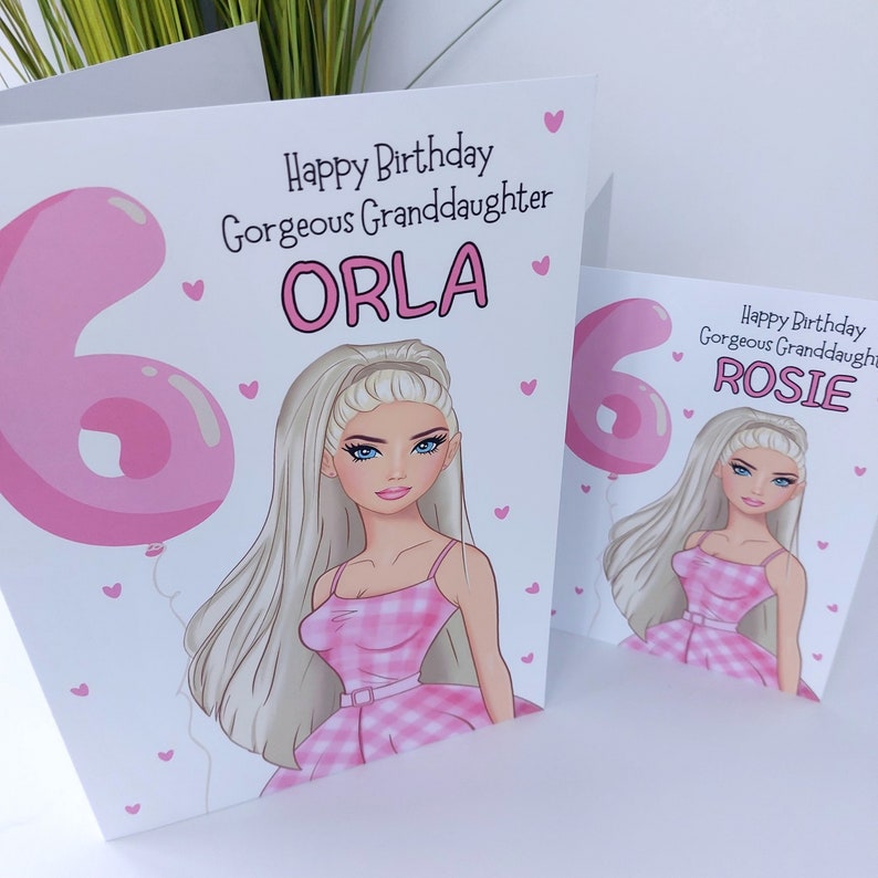 May include: Two birthday cards with illustrations of a girl in a pink dress. The cards read "Happy Birthday Gorgeous Granddaughter" with the names "ORLA" and "ROSIE". A pink number 6 balloon is also featured on the cards.