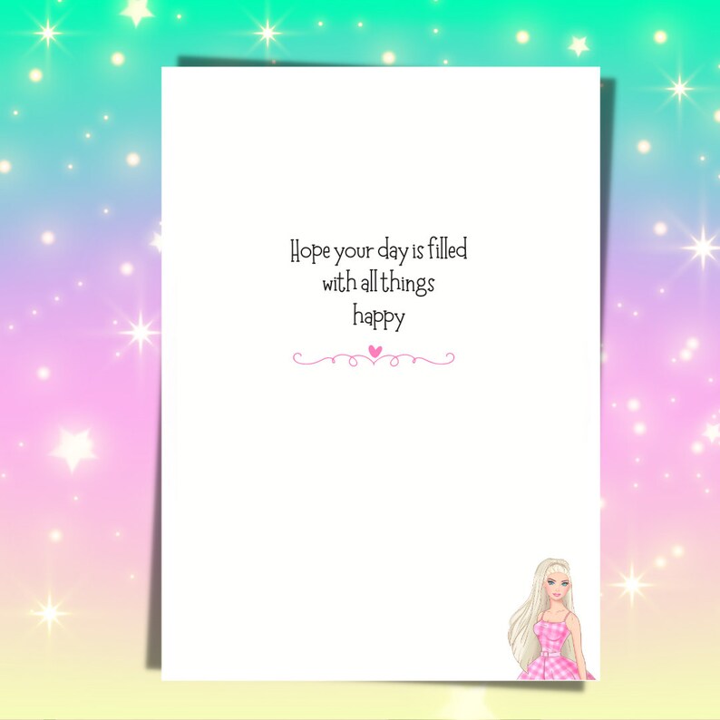 May include: A white greeting card with the text "Hope your day is filled with all things happy" in black script. A pink heart and decorative line are below the text. A cartoon illustration of a blonde woman in a pink dress is in the bottom right corner.