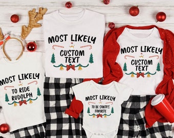 May include: White Christmas-themed shirts and pajamas with the text "Most Likely" and customizable text options. The shirts feature festive designs with candy canes, Christmas trees, and bells. The pajamas are black and white checkered.