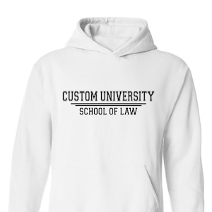 May include: White hooded sweatshirt with the text "CUSTOM UNIVERSITY SCHOOL OF LAW" printed in black.