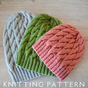 May include: Three knitted hats in different colors: gray, green, and pink. The hats are made with a cable knit pattern.  KNITTING PATTERN.