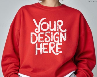 May include: Red sweatshirt with a white graphic that says "YOUR DESIGN HERE".