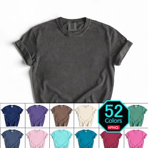 Puede incluir: Una camiseta gris carbón de manga corta con cuello redondo y mangas remangadas. La etiqueta interior del cuello dice Comfort Colors. Debajo de la camiseta principal, una cuadrícula muestra varios colores y un hexágono negro con 52 Colors +PNG.
