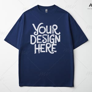 May include: A navy blue t-shirt with the text "Your Design Here" printed in white on the front.