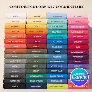 May include: A Comfort Colors 1717 color chart featuring a grid of folded fabric swatches in various shades. Each swatch is labeled with its specific color name, including white, ivory, chambray, blossom, butter, banana, island reef, peony, mustard, citrus, chalky mint, crunchberry, melon, burnt orange, seafoam, watermelon, terracotta, paprika, lagoon blue, heliconia, bright salmon, chilli, flo blue, crimson, cumin, brick, blue jean, red, yam, espresso, denim, boysenberry, khaki, bay, ice blue, vineyard, sandstone, sage, washed denim, berry, grey, moss, mystic blue, violet, granite, hemp, china blue, pepper, light green, royal caribe, periwinkle, graphite, blue spruce, black, true navy, neon lemon, and neon red orange.