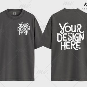 May include: A dark gray t-shirt with short sleeves. The front of the shirt has the text "YOUR DESIGN HERE" printed in white. The back of the shirt has the same text printed in white.