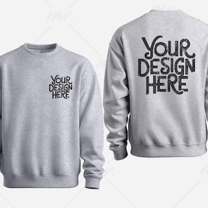 May include: A gray sweatshirt mockup with the text "Your Design Here" on the back and front. The sweatshirt has a crew neck and long sleeves.