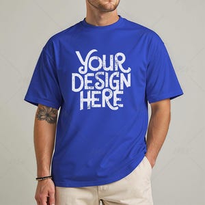May include: A royal blue t-shirt with the text "Your Design Here" in white.