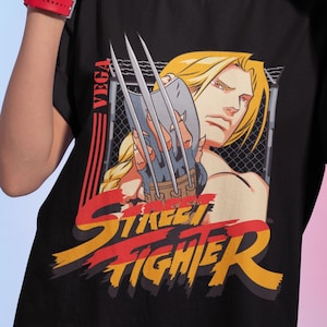 Vega Claw SF2 The World Warrior プレミアム ユニセックス T シャツ。