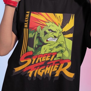 ブランカ チャンプ SF2 ザ ワールド ウォリアー プレミアム ユニセックス T シャツ。