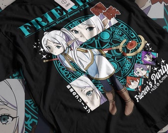 May include: Black t-shirt featuring a blue and white illustration of a character from the anime "Frieren: Beyond Journey's End". The illustration includes a circle with Japanese text and other characters from the anime. The text "Frieren's Party" is printed on the bottom right corner of the shirt.