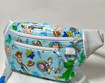 Toy themed fanny pack / waist bag with three zippered pockets