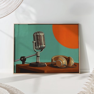 May include: A framed wall art print featuring a silver vintage-style microphone on a stand and a pair of tan over-ear headphones resting on a brown wooden surface. The background is a solid teal color with a large, solid orange circle behind the mic.