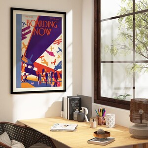 Boarding Now Airplane in a black frame above a desk in a home office
