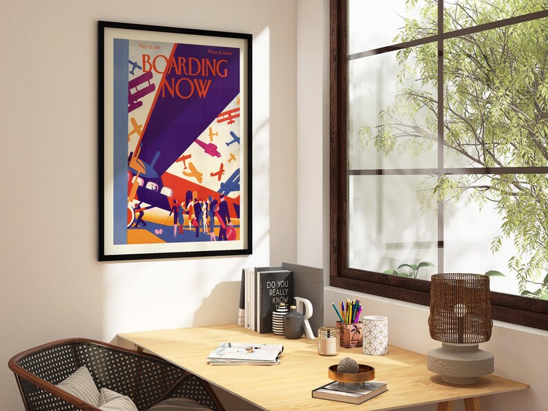 Boarding Now Airplane in a black frame above a desk in a home office
