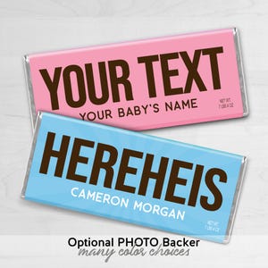 May include: Two chocolate bar wrappers, one pink and one blue, with the text "YOUR TEXT YOUR BABY'S NAME" and "HEREHEIS CAMERON MORGAN" printed on them. The wrappers are designed to look like candy bar wrappers and have a net weight of 7 lbs 4 oz printed on them.