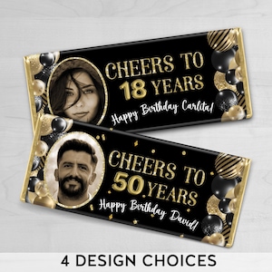May include: Two black and gold chocolate bar wrappers with a photo frame and text. The top wrapper says "Cheers to 18 Years Happy Birthday Carlita!" The bottom wrapper says "Cheers to 50 Years Happy Birthday David!"