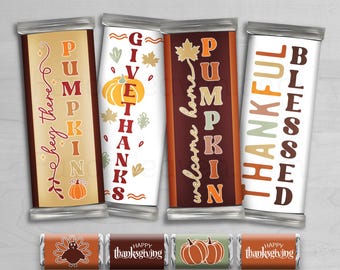 May include: Set of 24 printable chocolate bar wrappers featuring Thanksgiving and autumn themes. The wrappers feature various designs with pumpkins, turkeys, and fall foliage. The text on the wrappers includes "Pumpkin", "Welcome Home", "Blessed", "Thankful", "Give Thanks", and "Hey There".