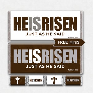 May include: A brown and white chocolate bar wrapper with the text "HE IS RISEN JUST AS HE SAID" and "FREE MINIS". The wrapper also includes a cross and the scripture reference "Matthew 28:6".