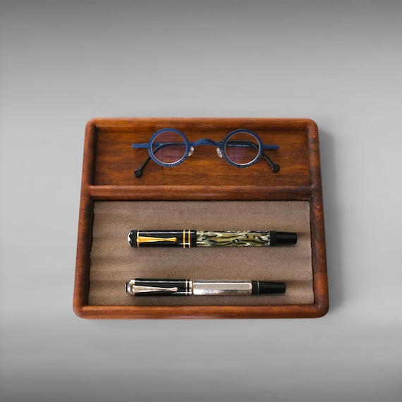A beautifully minimal solid walnut pen tray with 71 favorites to prove it — the kind of desk piece that makes everything around it look more intentional.