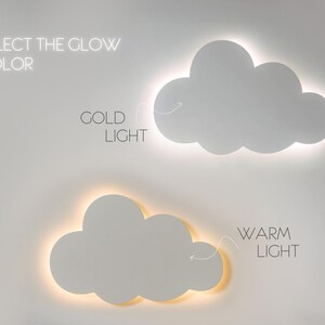 May include: Two white cloud-shaped wall lights with a choice of warm or gold light. Select the glow color.