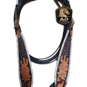 May include: A brown and black leather horse bridle with floral and geometric tooling. The bridle features white stitching and a decorative headstall. The logo "AD Saddler" is visible.