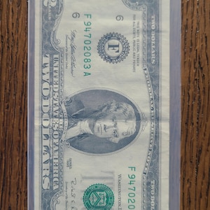 2 Dollar bill ending in 83.