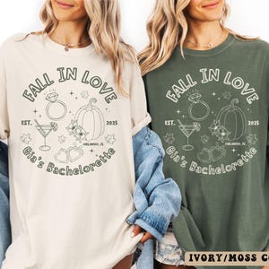 Bride tribe wearing matching fall bachelorette shirts with pumpkins, flowers, autumn leaves, and heart illustrations, perfect for rustic weddings.