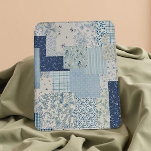 May include: A rectangular case featuring a patchwork design in various shades of blue and white. The pattern incorporates floral, plaid, and striped elements. The case is likely for a tablet or e-reader.